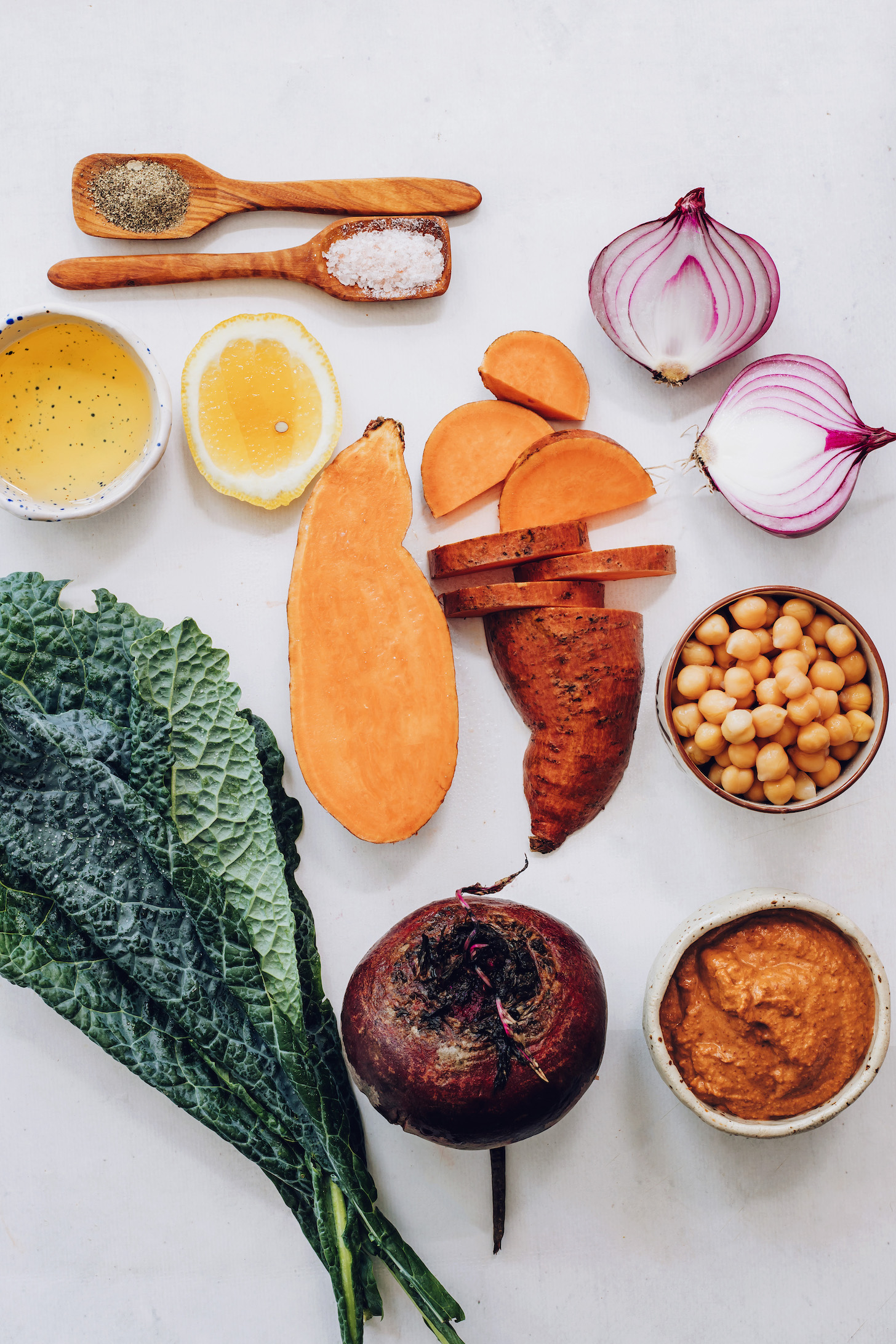 Kale, beet, sweet potato, chickpeas, chipotle pecan pesto, red onion, lemon, salt, and olive oil