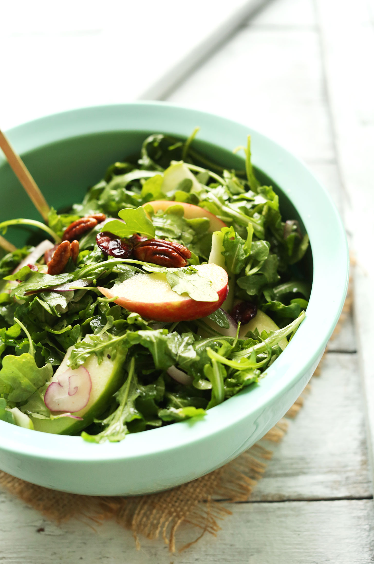 Big bowl of our Easy Apple Arugula Salad with Pecans and Lemon Vinaigrette