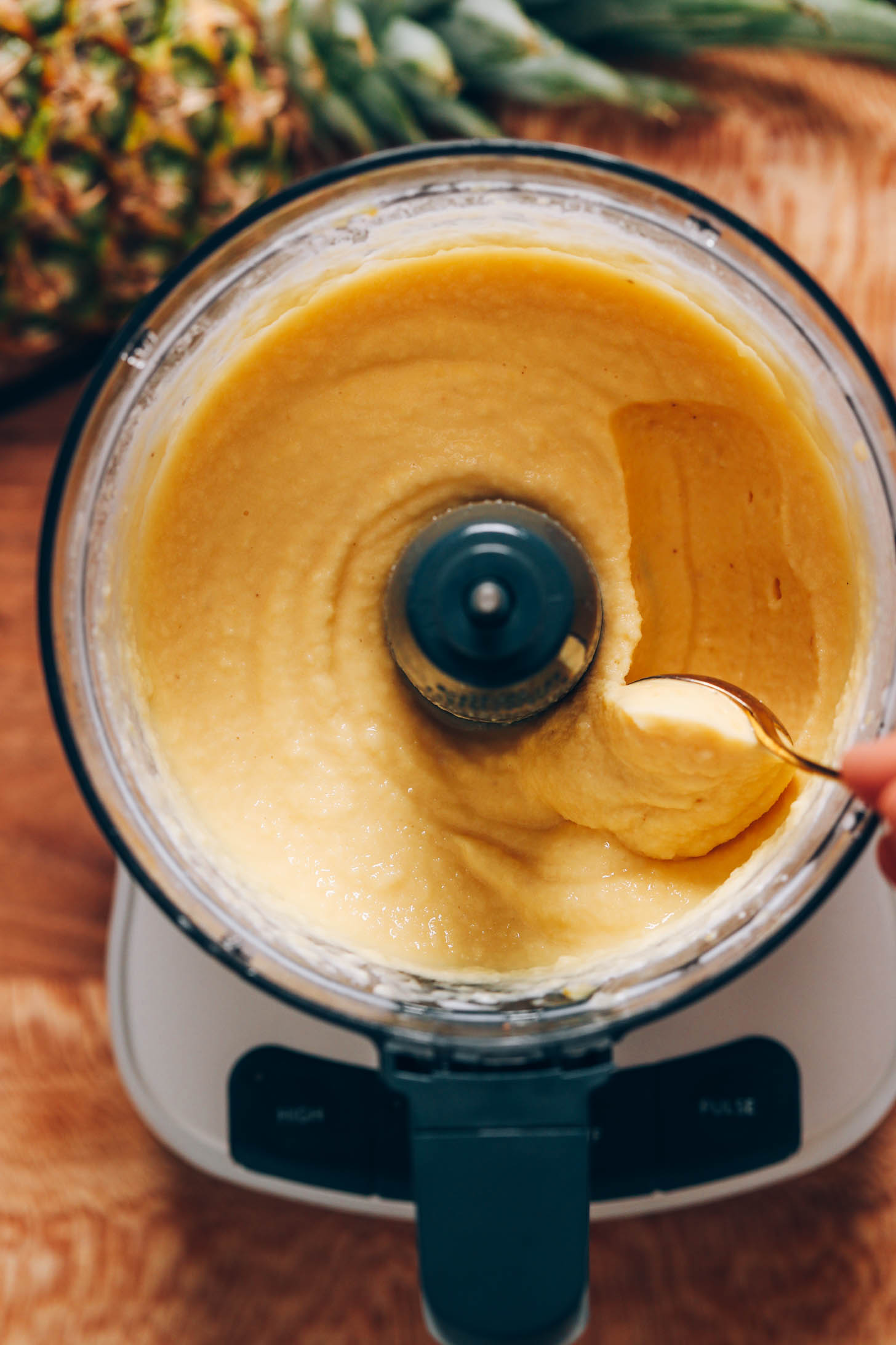 Using a spoon to show the creamy texture of the sorbet