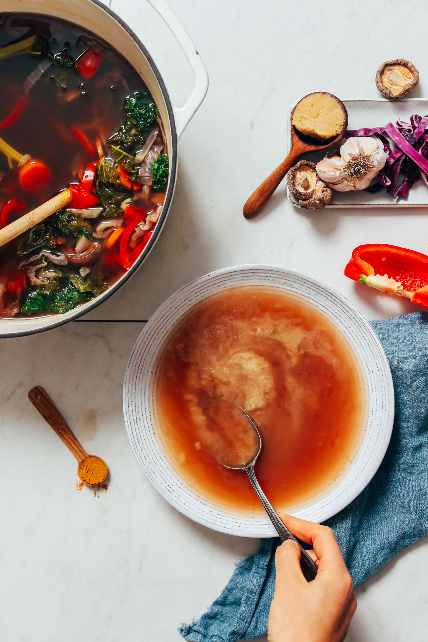 Stirring miso into homemade vegetable broth