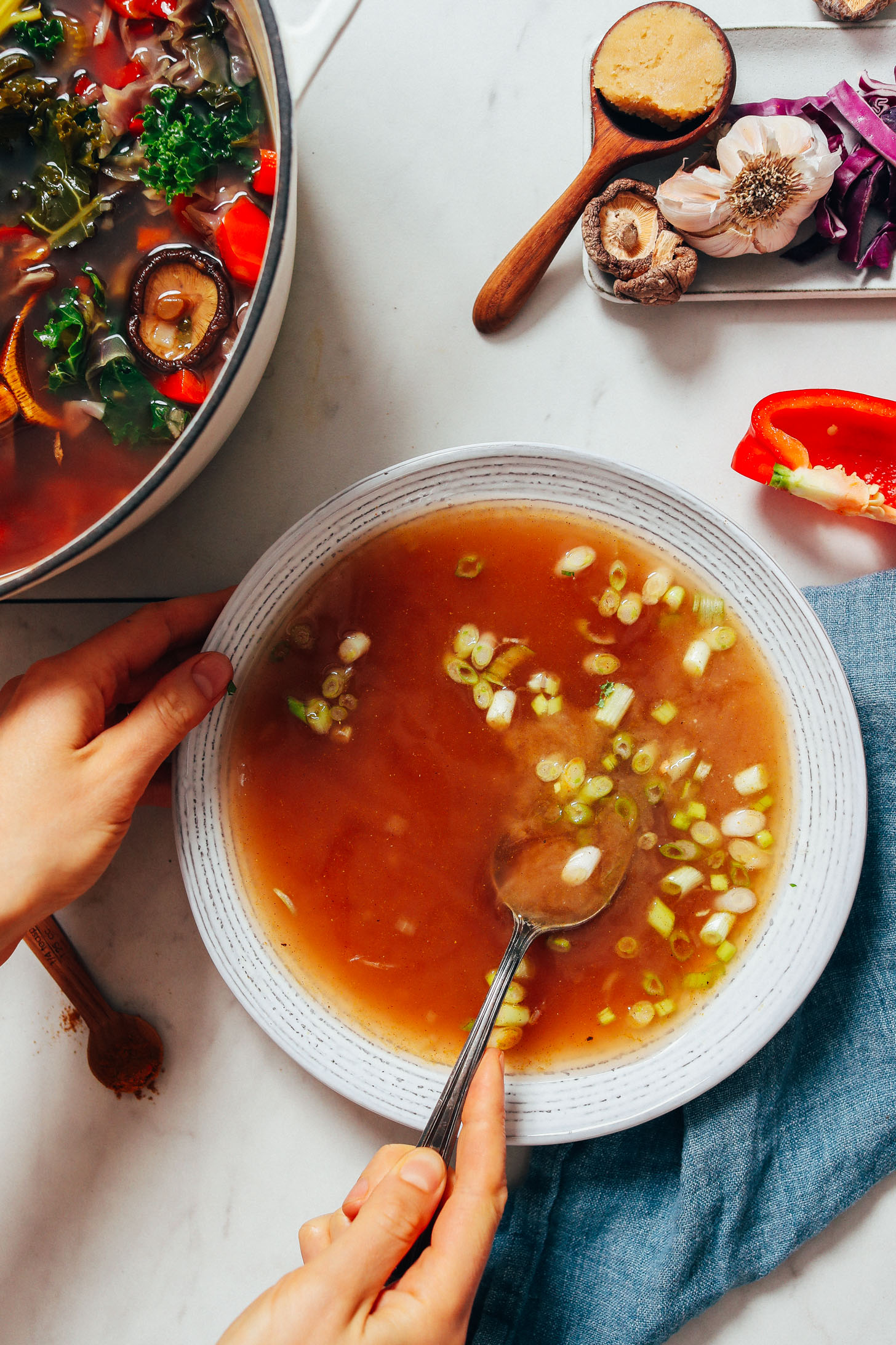 Stirring a bowl of miso tonic