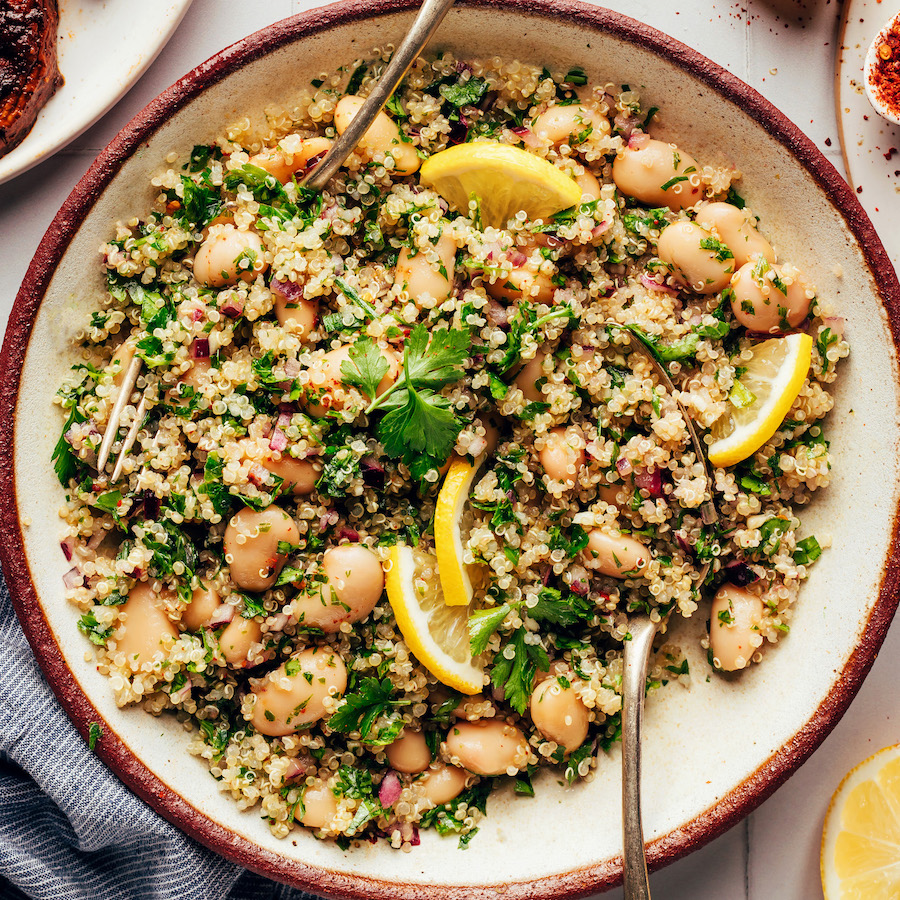 Close up shot of a bowl of white bean quinoa salad