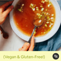 Stirring a miso tonic next to a pot of gut-calming vegetable broth