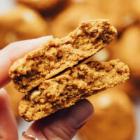 Holding up a split open breakfast cookie to show the inner texture