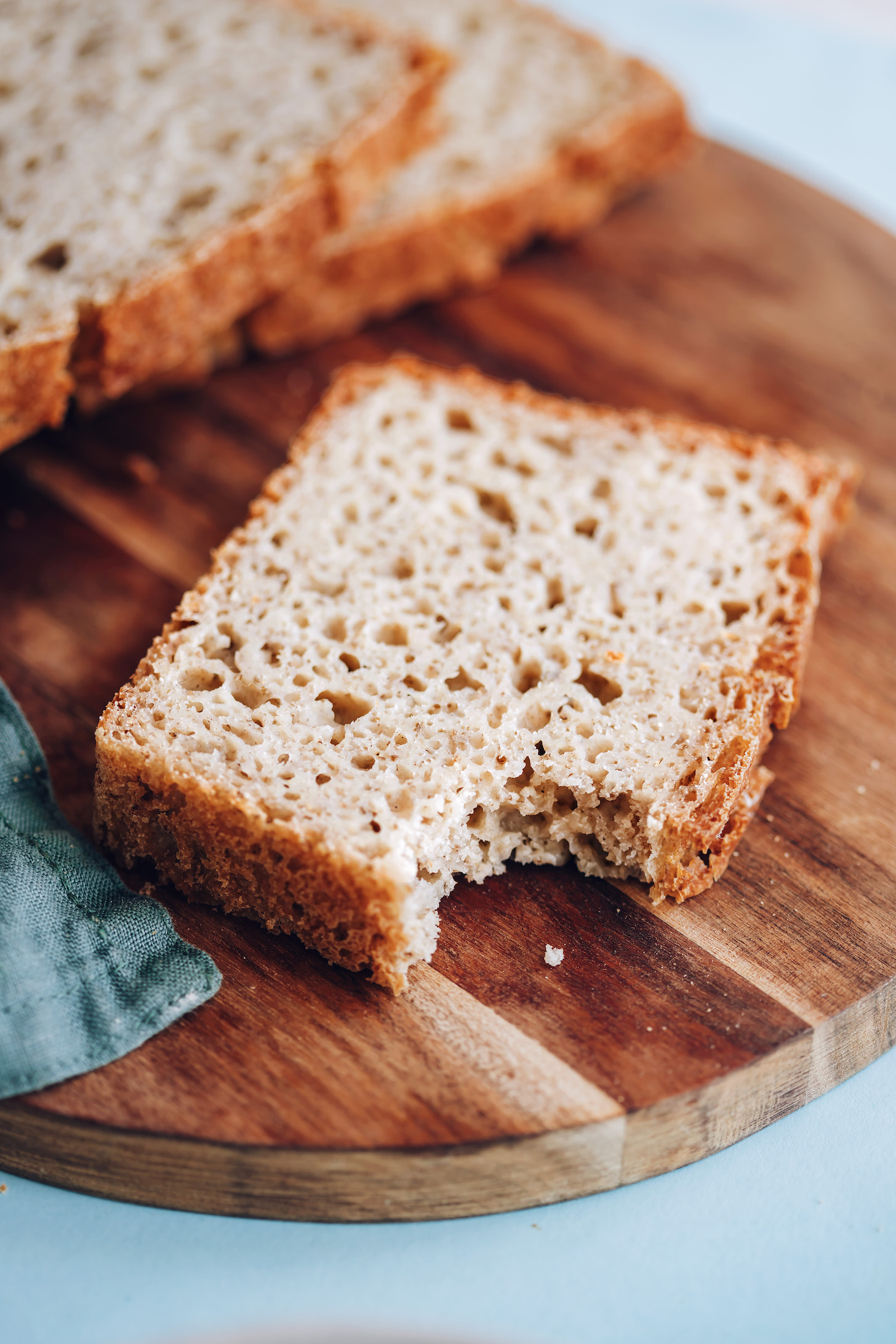 Bite eaten from a slice of gluten-free sandwich bread