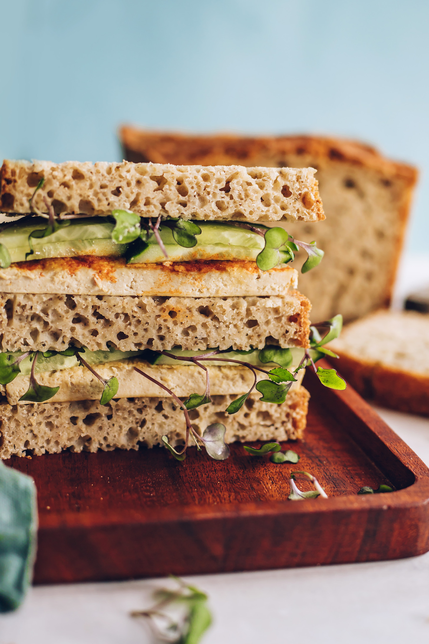 Sandwich with cucumber, sprouts, and tofu