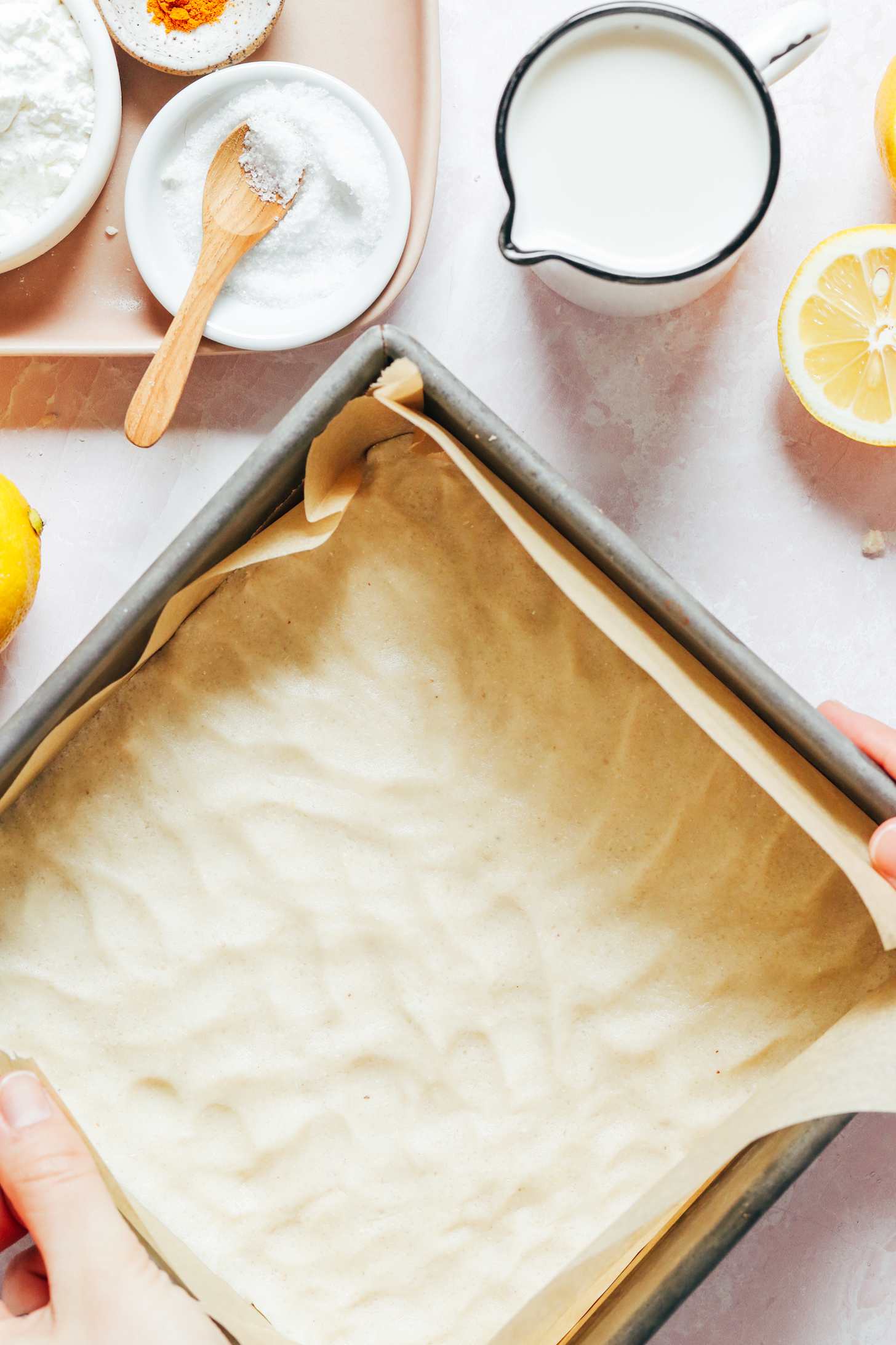 Lemon bar shortbread crust pressed into a square baking pan